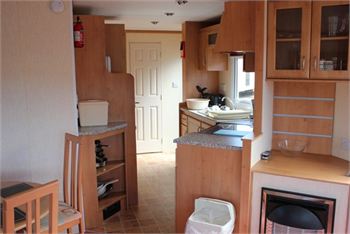 Photo of the kitchen in a Pre owned Delta Denbigh 2007 static caravans for sale in Brean Sands, Somerset